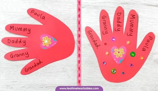 A red handprint craft decorated with hearts and stickers. Easy Valentine's Day craft for kids.