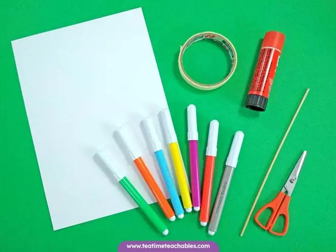 Craft materials for the St. Patrick's Day craft - pens, glue, paper and scissors.